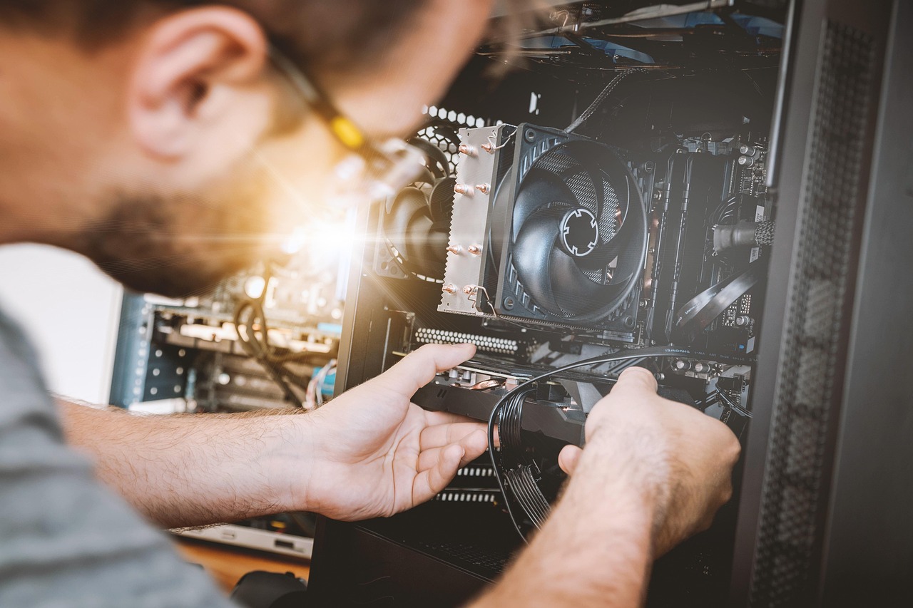 Technician assembling a computer