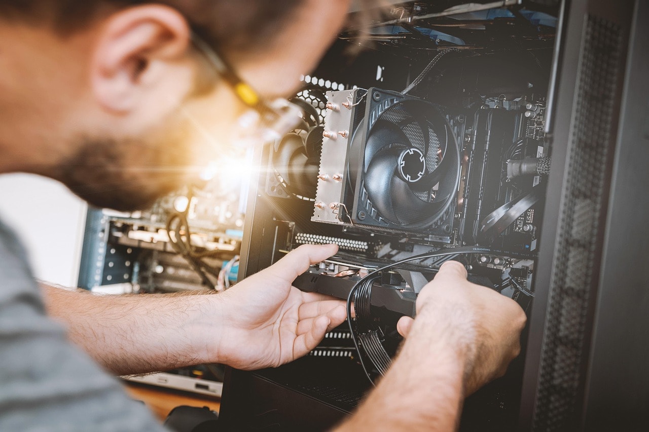 Technician assembling a computer